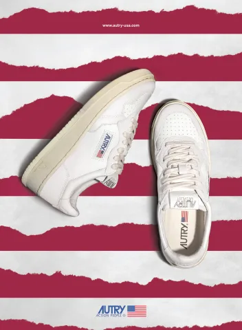 Press ad: two sneakers photographed across torn paper stripes in Autry Red and white