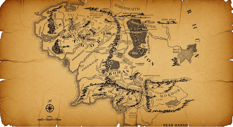 Middle-earth map from The Lord of the Rings on aged parchment, with the Misty Mountains dividing west from east, the Anduin running north to south, and Mordor fenced in by mountains